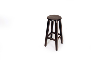 wooden chair on a white background. bar stool made of dark wood.