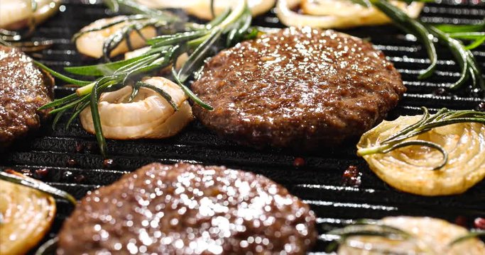 Grilling burgers on the grill plate, 4k. Grill food