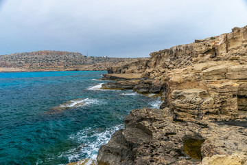 A large boulder broke off from the coastal cliff.