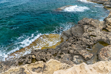A large boulder broke off from the coastal cliff.