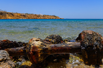 Fototapeta premium remains of an old car at sea