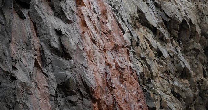 Cracks in the cave in basalt rocks, water flows