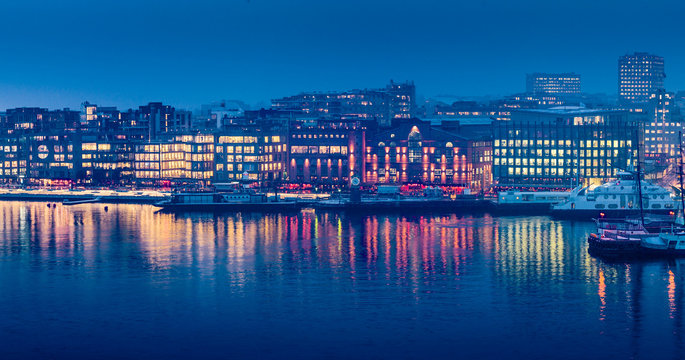 City lights in twilight. Aker Brygge - downtown Oslo - as seen from Akershus fortress.