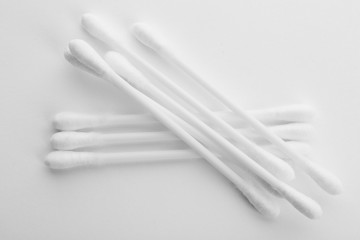 Plastic cotton swabs on white background, top view