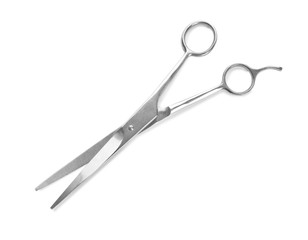 Pair of sharp hairdresser's scissors on white background
