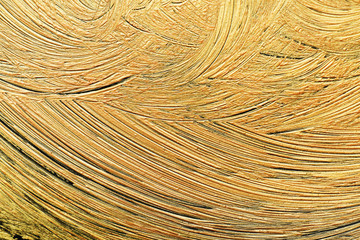 Golden paint brush strokes as background, closeup