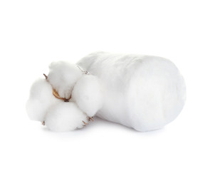 Fototapeta na wymiar Fluffy cotton roll and flower on white background