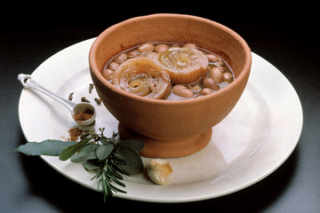 Italian food recipes, traditional Tofeja with pork rind  and beans in terracotta cup