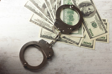 handcuffed money on the table