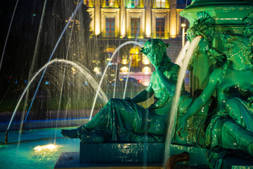 Ornamental park fountain at night in Geneva City