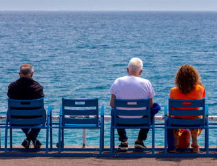 Tourists vacationing on the city promenade on a sunny day. Nice. France. © pillerss