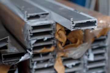 Closeup of Bent metal profile channel. Furniture fittings.