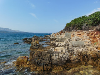 Fototapeta na wymiar View of the rocky shore of Three island beach.