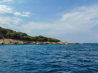 View of the rocky shore of Three island beach.
