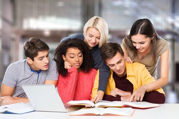 Four Young students studying subject on background