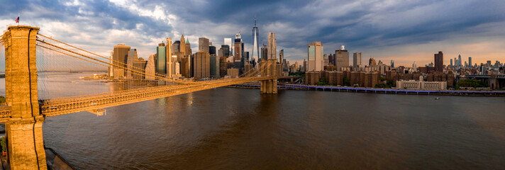 Famous Skyline of downtown New York and Manhattan wiith Brooklin Bridge at the early morning sun...
