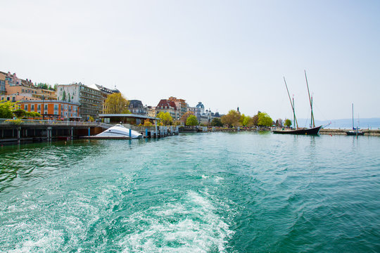 Imege of Evian-les-Bains city port in France taken from ferry boat on Lake Geneva