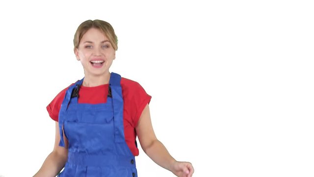 Woman in construction helmet dancing on white background.