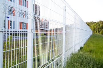 Look for white lattice fence in the future. Selective focus. Construction technology.