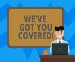 Text sign showing We Ve Got You Covered. Conceptual photo Insurance business and demonstratingal protection service Blank Bordered Board behind Man Sitting Smiling with Laptop Mug on Desk