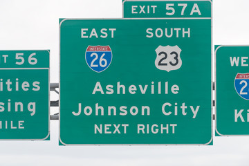 Asheville and Johnson City exit sign on highway in Tennessee on interstate 81 closeup of text