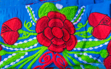 Fototapeta na wymiar Colorful Mexican Blue Red Flower Blanket Textiles Handicrafts Oaxaca Mexico