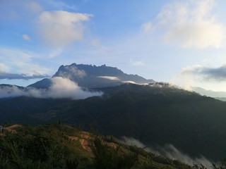 Beautiful sunrise overlooking Mount Kinabalu on a bike journey