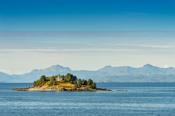 Guard Island and lighthouse at entrance to Tongass Narrows, early morning near Ketchikan, Alaska.