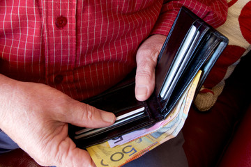 A man with Australian money in his wallet.
