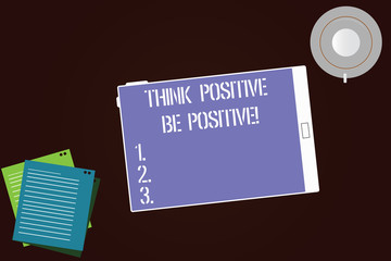 Writing note showing Think Positive Be Positive. Business photo showcasing Always have motivation attitude positivism Tablet Screen Cup Saucer and Filler Sheets on Color Background