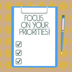 Word writing text Focus On Your Priorities. Business concept for Make a plan based on important things to do Blank Sheet of Bond Paper on Clipboard with Click Ballpoint Pen Text Space