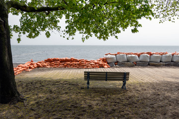 Plastic flood protection sandbags stacked into a temporary wall