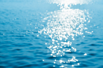 Naklejka na ściany i meble Bokeh of water reflection from sun light