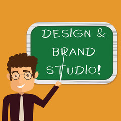 Conceptual hand writing showing Design And Brand Studio. Business photo text Modern designing space professional office Man Holding Stick Pointing to Wall Mounted Blank Color Board