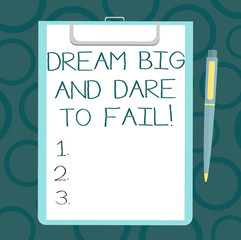 Writing note showing Dream Big And Dare To Fail. Business photo showcasing Motivation inspiration prepare to make mistakes Sheet of Bond Paper on Clipboard with Ballpoint Pen Text Space