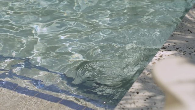 Shimmering Pool Water. 4k 75 FPS Slow Motion