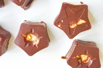 Tasty sweet cashew candies with dark chocolate