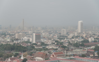 Obraz premium Cityscape of Bangkok the capital cities of Thailand covered by bad air pollution it is unhealthy. Pollution is a mixture of dust, dirt, soot and smoke.