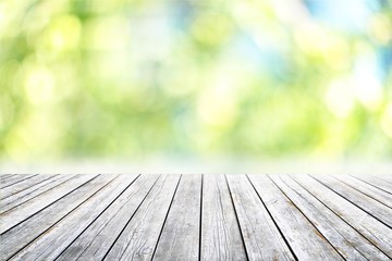 Empty wooden surface on blurred background