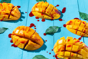 Mexican snack: Cutted tropical mango fruit with chilli 