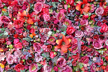 Beautiful colors of plastic Rose and Lilly flower bouquet with different flowers. Decorative...