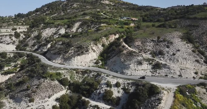 Cinematic Drone Aerial of Car and Road on Picturesque Hill in Cyprus Island Mediterranean Sea 4k