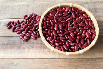 red bean  in bowl isolated on wood background