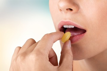 Close up on a beautiful girl while enjoying  gum