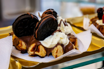 Breakfast waffles with strawberries and chocolate toppings
