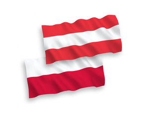 National vector fabric wave flags of Austria and Poland isolated on white background. 1 to 2 proportion.