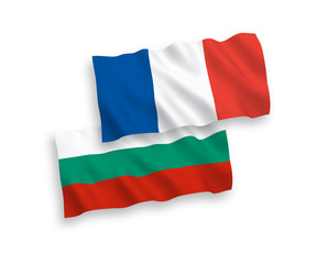 Obraz premium National vector fabric wave flags of France and Bulgaria isolated on white background. 1 to 2 proportion.