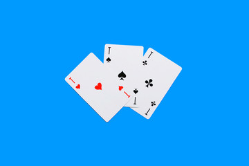 Playing card. Hand with card playing poker .close up of male hand with playing cards and chips at...