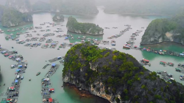 a floating fisherman's village in ha long bay, northern vietnam. top view, aerial view, quadcopter, movement, motion, 4K move flying drone