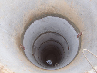 Water Well Drilling. Digging a well for water. Inside The Well. Water production. The problem with water supply. Drought. Construction work. Deep hole.